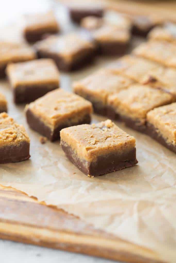 pieces of peanut butter fudge on parchment paper