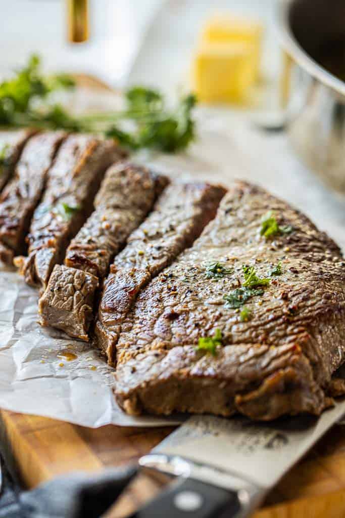 steak cut into thick slices