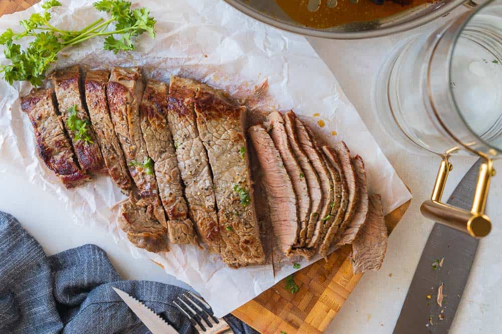 top down shot of steak sliced into thick and thin slices