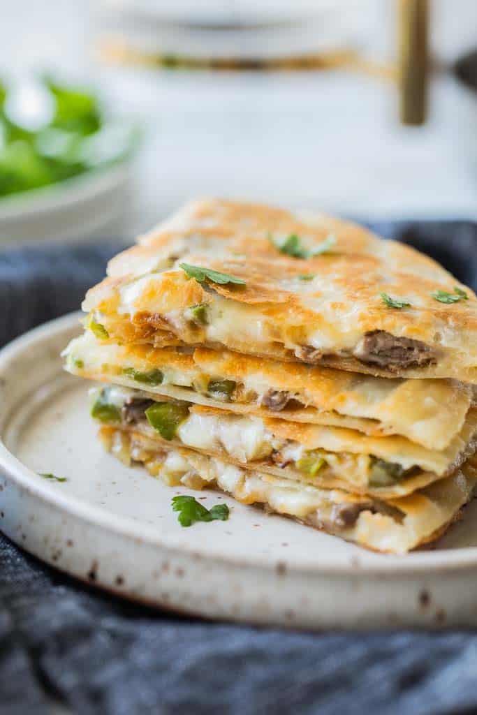 quesadilla wedges stacked on plate