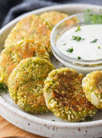 close up view of veggie nuggets on plate with dipping sauce