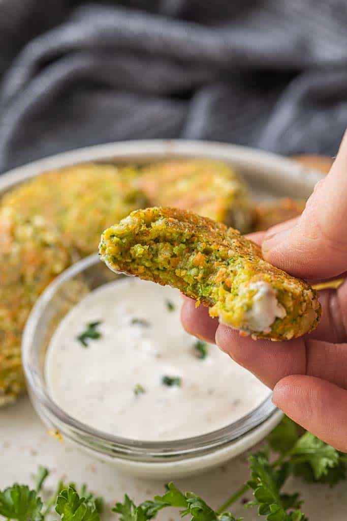 hand holding veggie nugget with bite missing