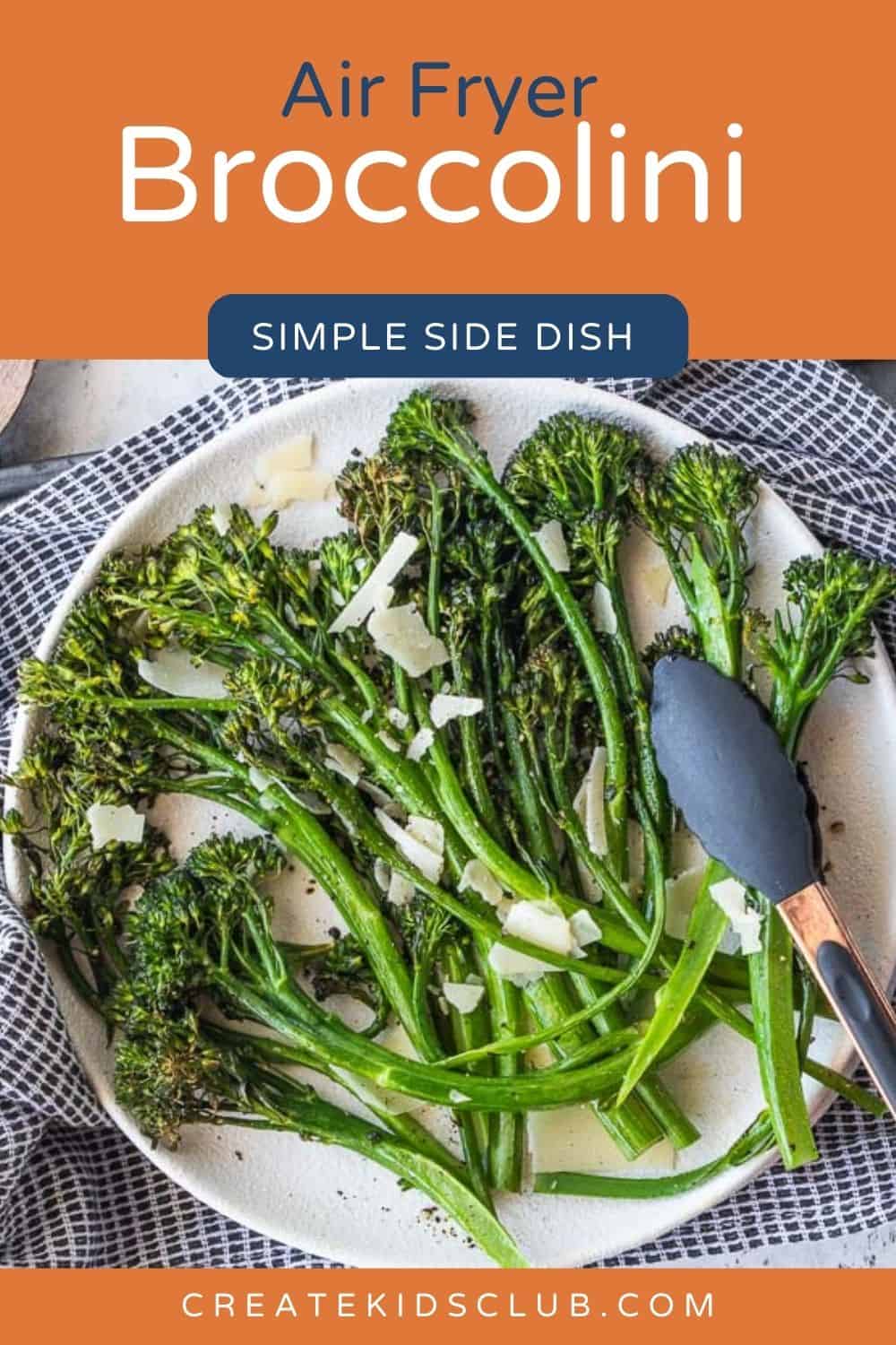 a pin of broccolini on a plate with a tong picking some up