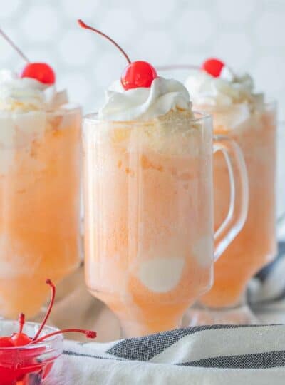 three ice cream floats in glass cups