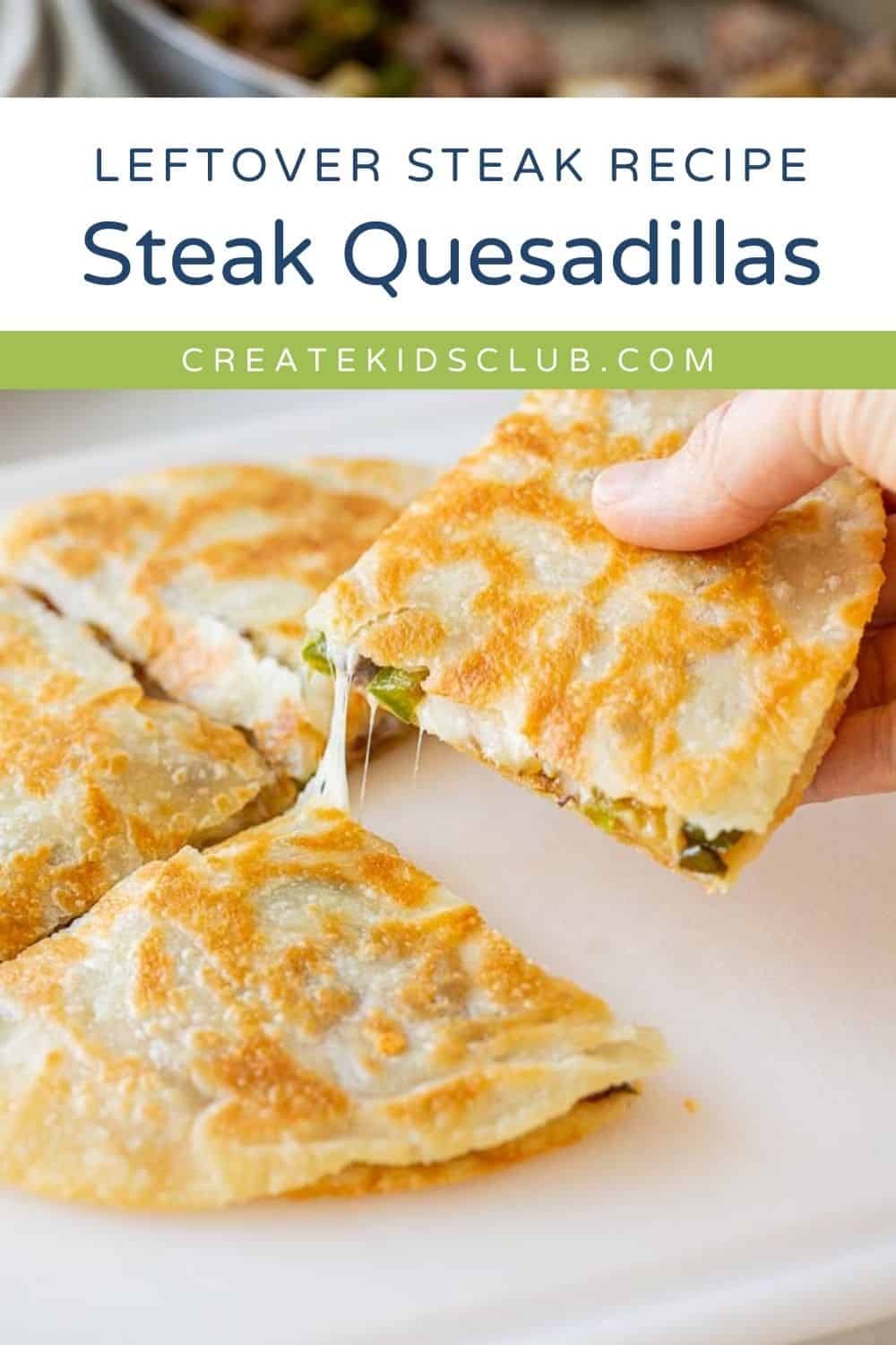 steak quesadilla wedges on a plate with a hand taking one pulling cheese