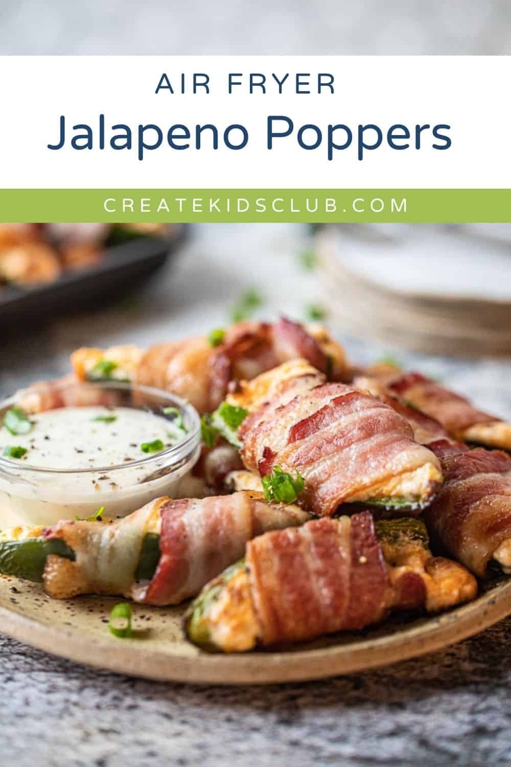 pin of jalapeno poppers on a plate