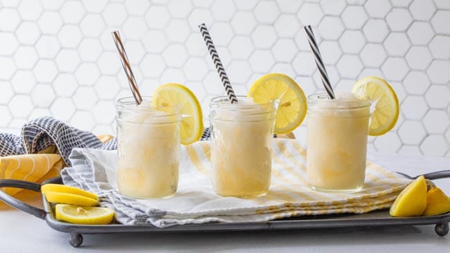 three glass jars filled with frozen lemonade