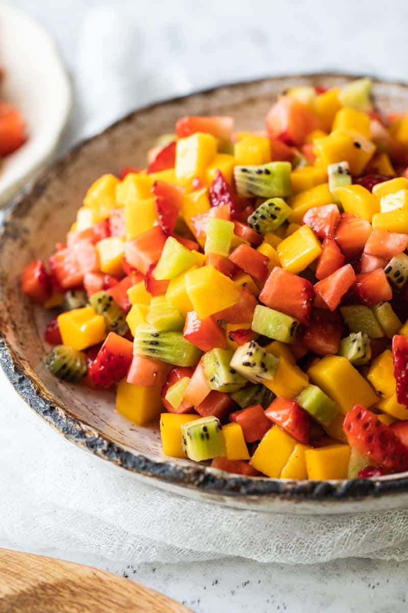 fruit salsa featuring kiwi, mango, strawberries in bowl