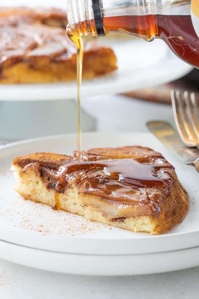 maple syrup drizzled over the top of a piece of pancake