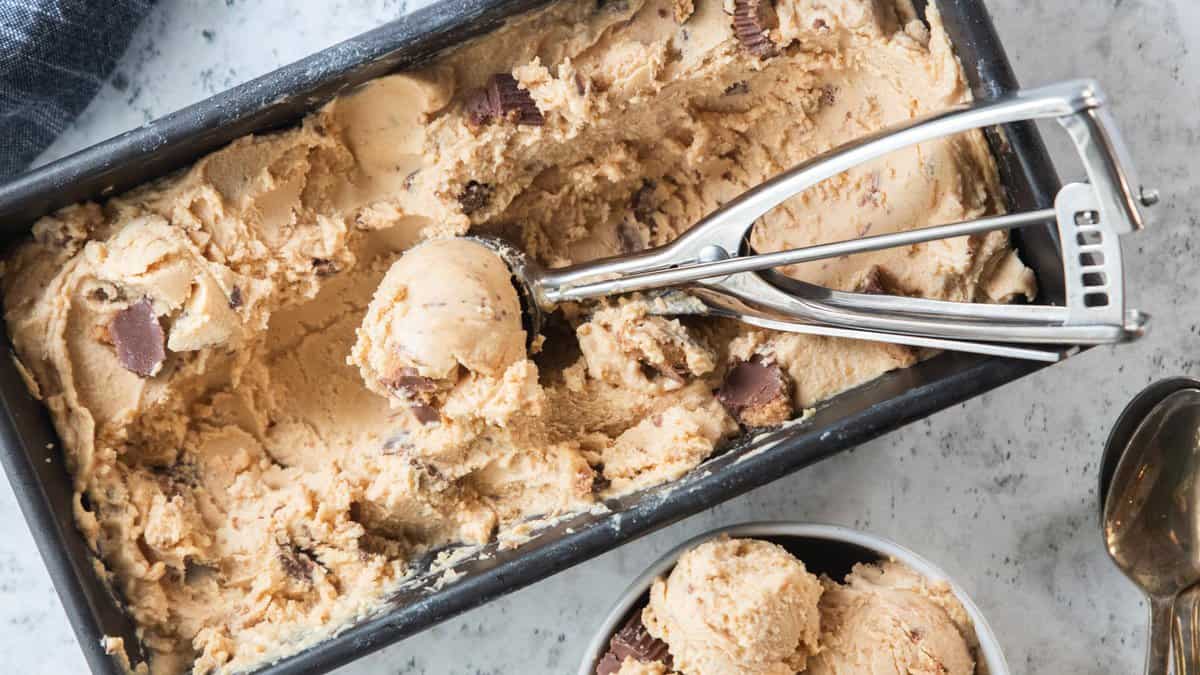 top down shot of ice cream scoop in pan of ice cream