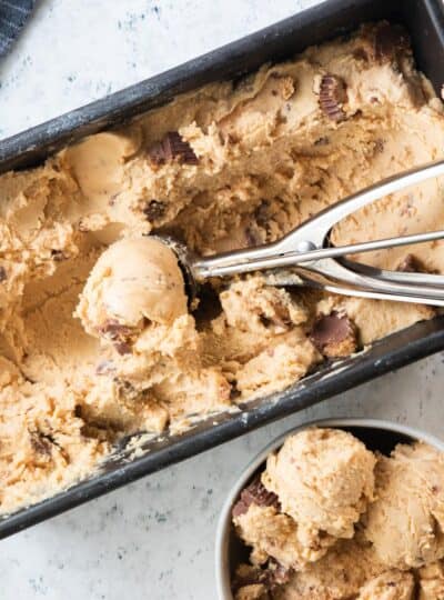 top down shot of ice cream scoop in pan of ice cream