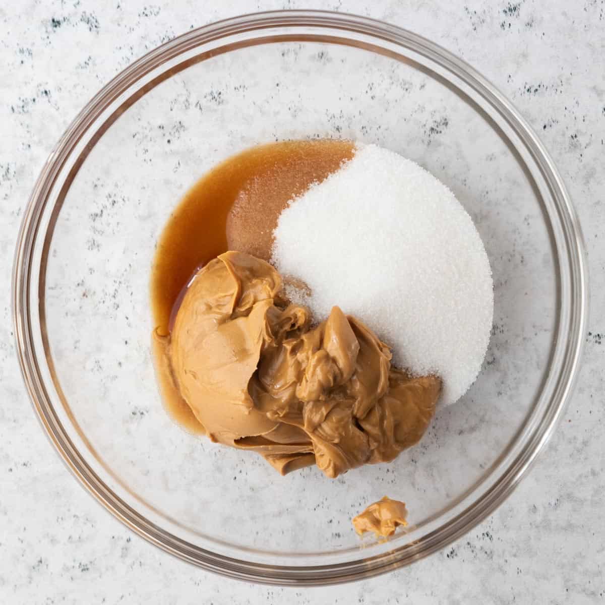 peanut butter, sugar and vanilla extract in bowl