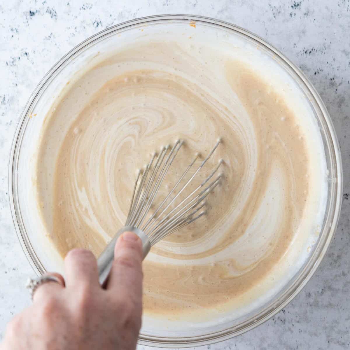 whisk mixing ingredients in a bowl