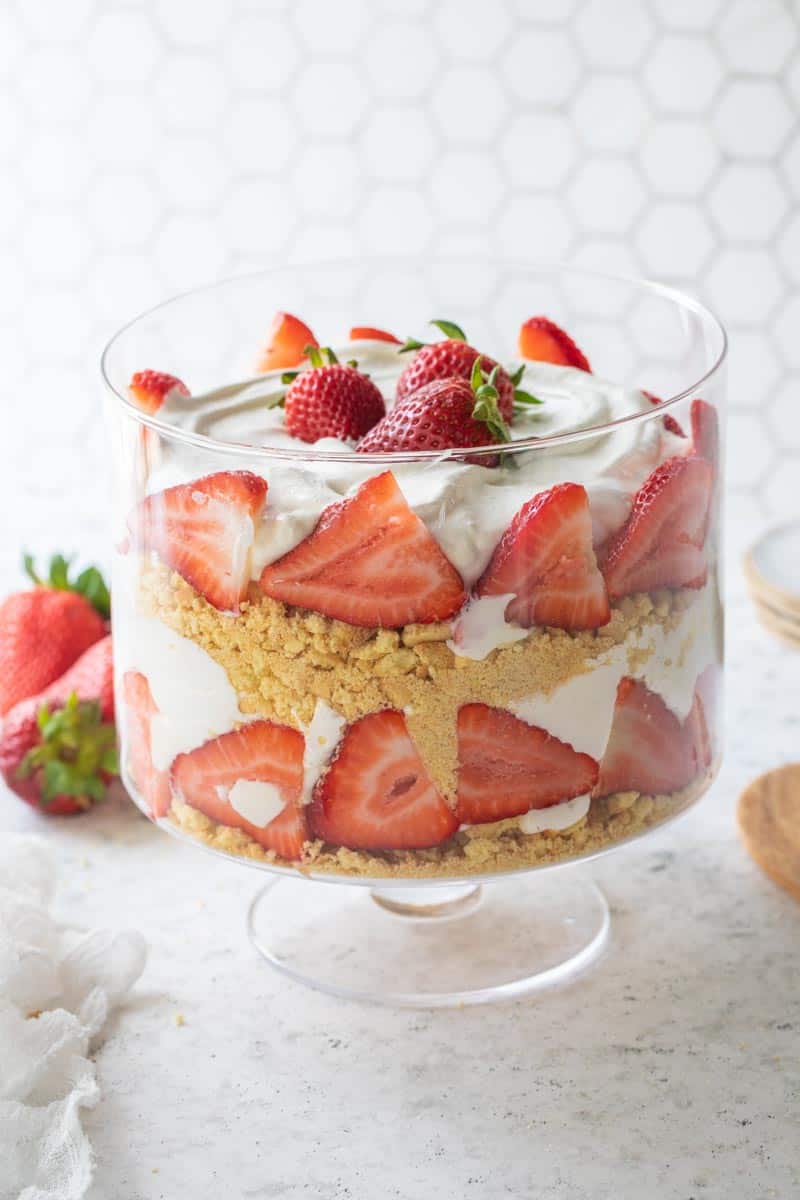 layered berry dessert in trifle bowl