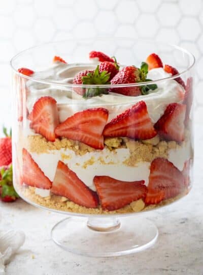 trifle bowl layered with gluten free vanilla wafers, cool whip and berries