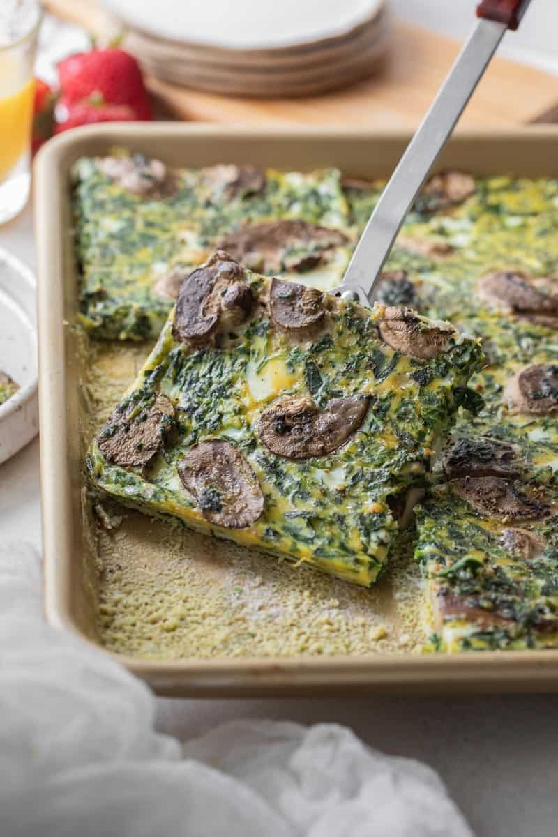 slice of baked eggs removed from sheet pan