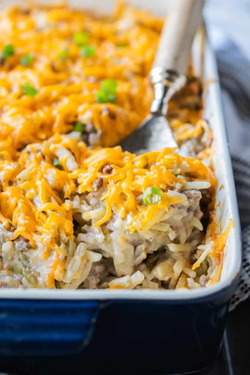 spoon scooping into hamburger hashbrown casserole