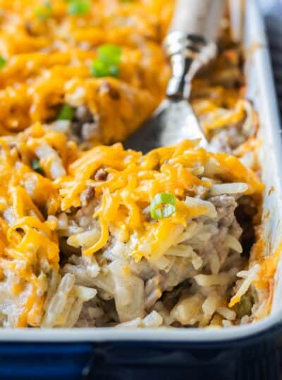 spoon scooping into hamburger hashbrown casserole