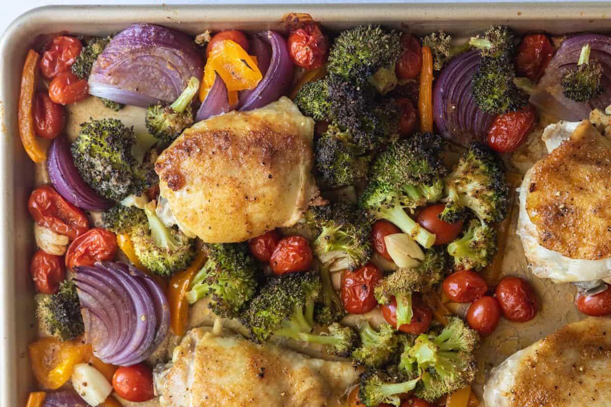 roasted chicken and vegetables on a sheet pan