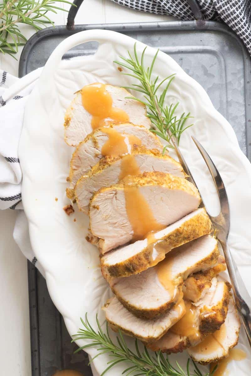 top down shot of slices of turkey breast drizzled with gluten free gravy