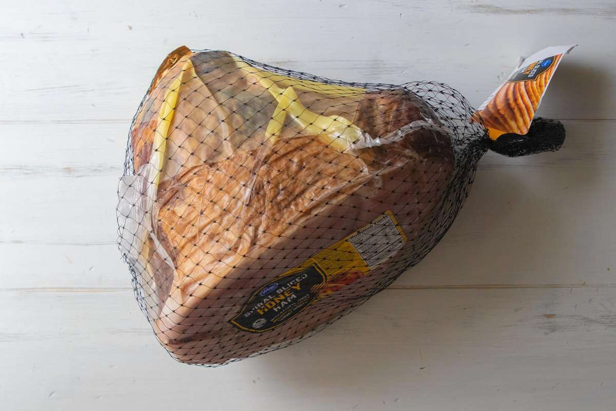 a packaged spiral sliced honey ham on a countertop