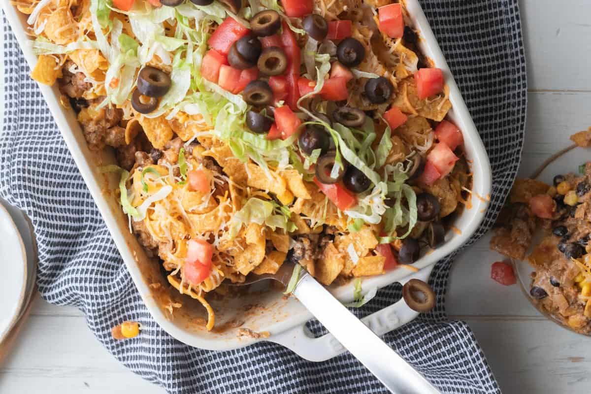 top down view of large spoon in walking taco casserole