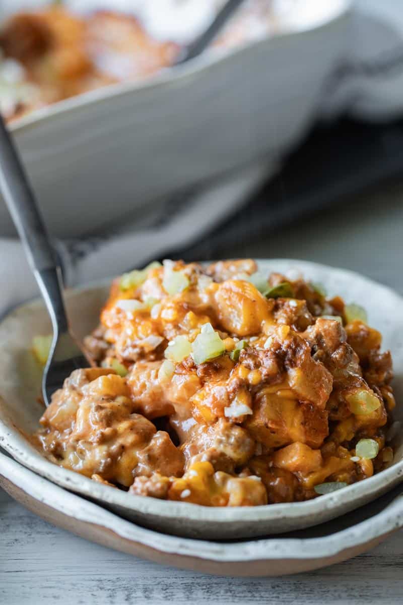 cheeseburger casserole in a serving bowl with a fork