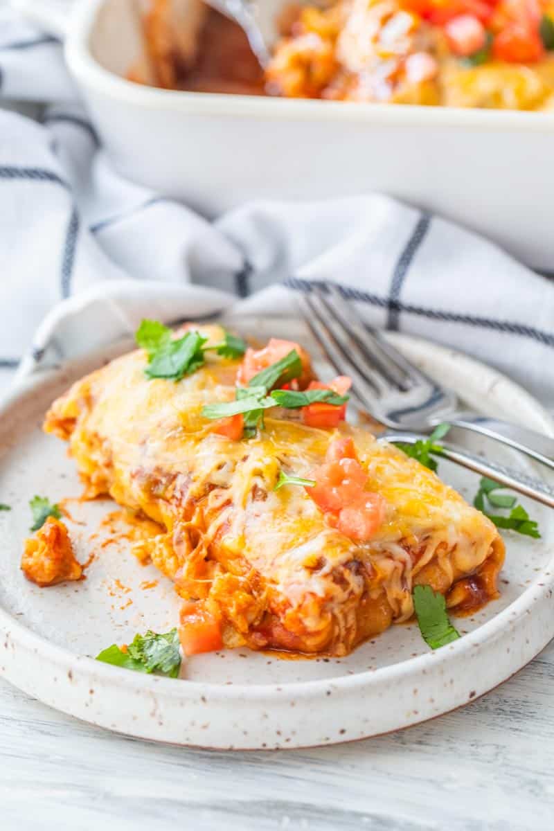 fork and cheesy burrito casserole on a plate