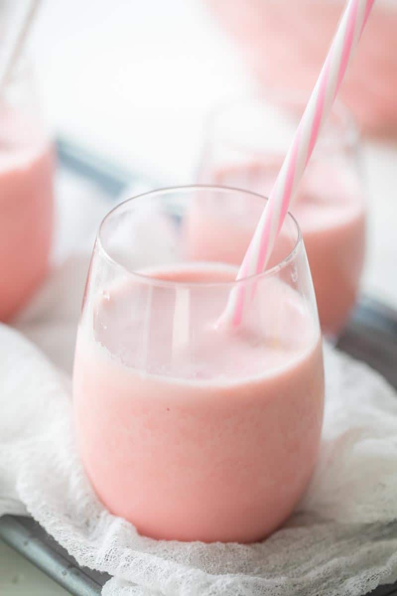 pink punch in glass with a straw