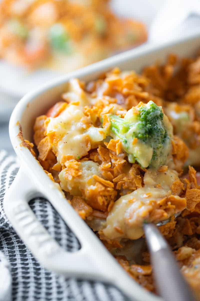 spoon scooping vegetable casserole from a dish