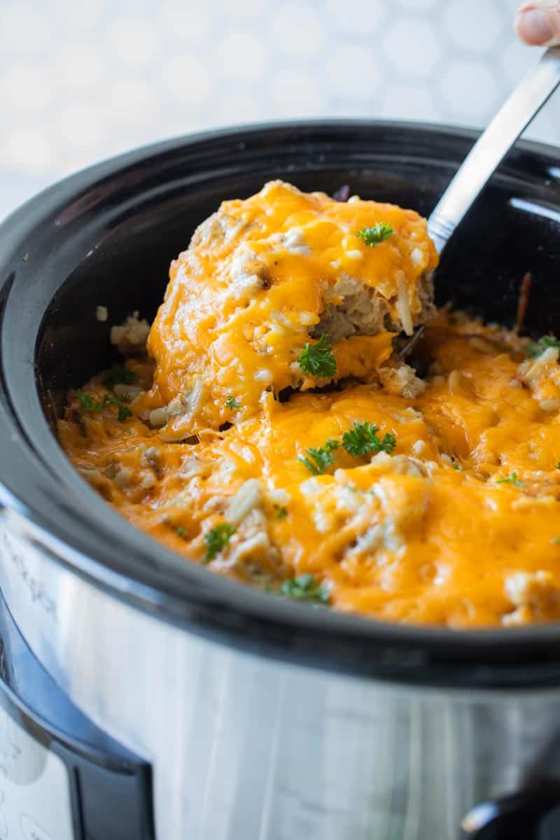 crockpot breakfast casserole scooped from slow cooker