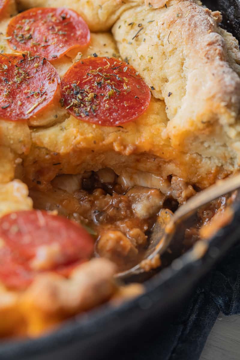 spoon in a skillet of pizza pot pie