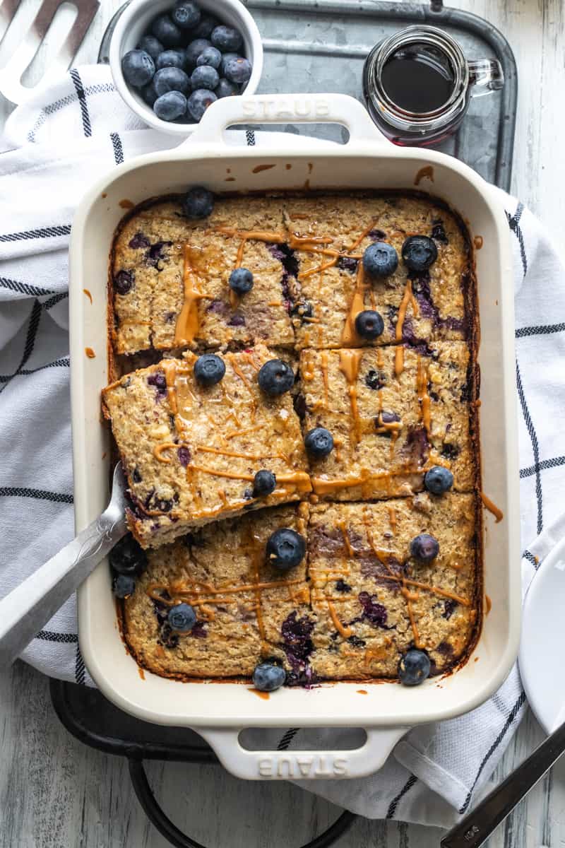 baked oatmeal cut into 6 slices in a baking dish