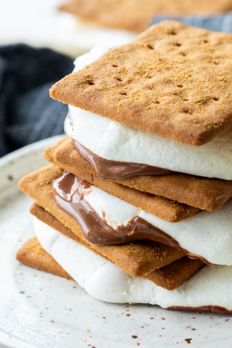 stacked smores with melted chocolate and marshmallows