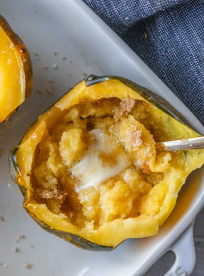 acorn squash half filled with butter and brown sugar