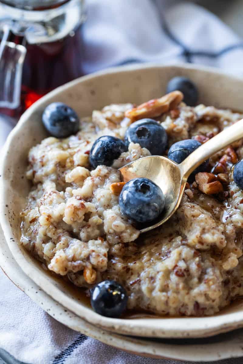 oatmeal with flaxseed in a bowl topped with fresh blueberries