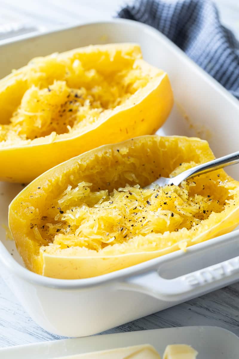 side view of sliced open cooked spaghetti squash