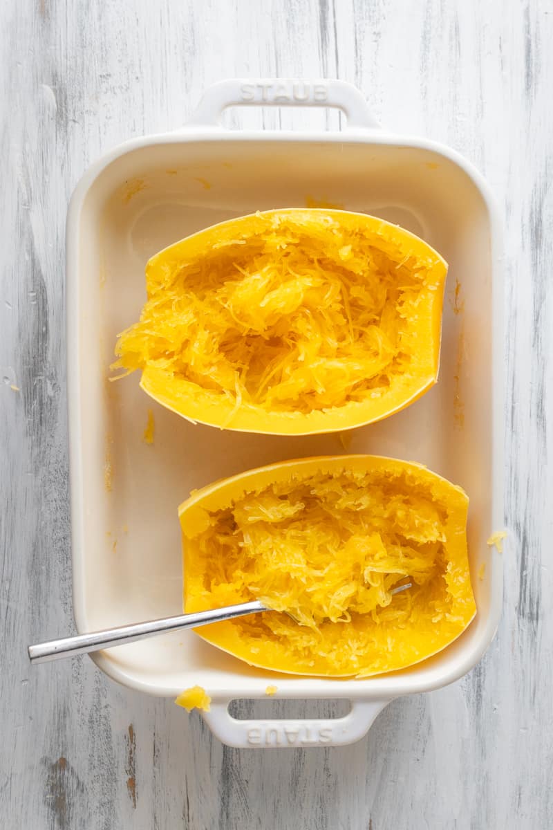 spaghetti squash halves in baking dish