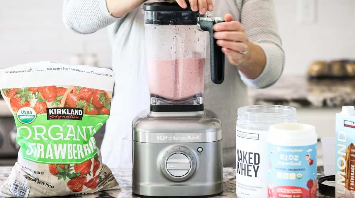 a smoothie being blended in a blender