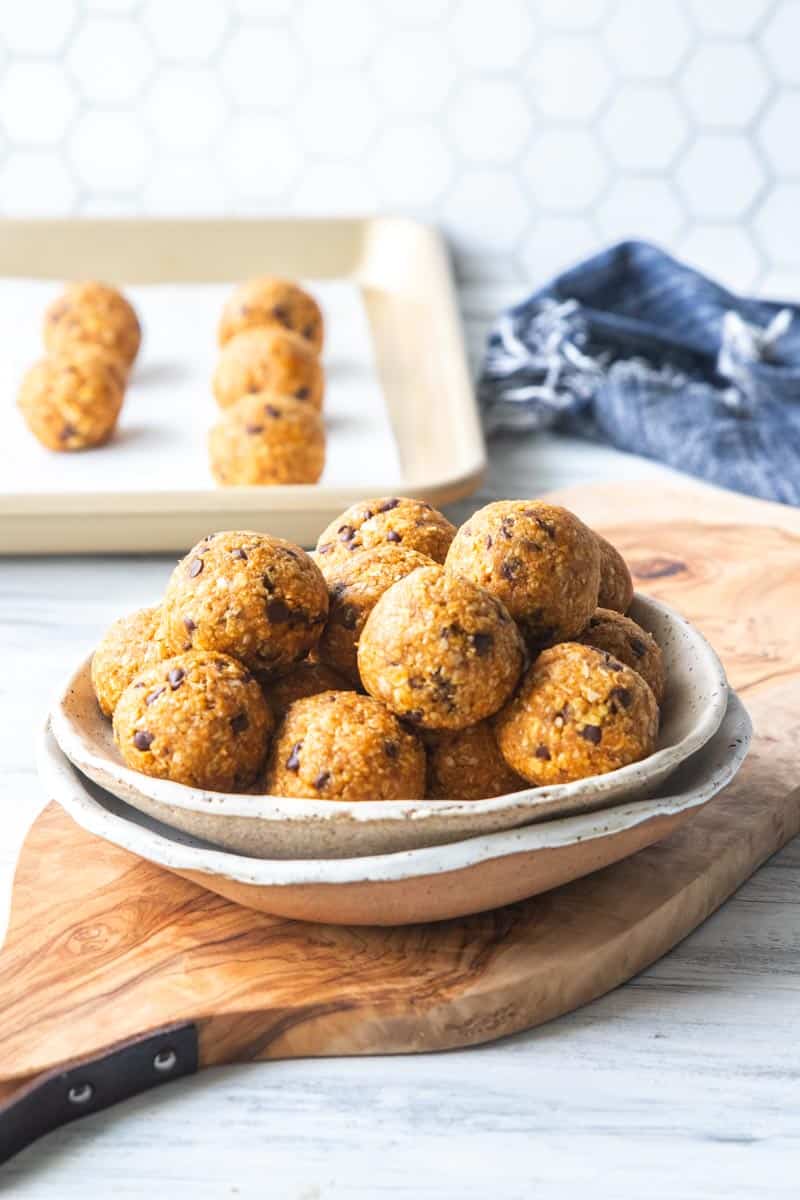 pumpkin protein balls stacked in a bowl