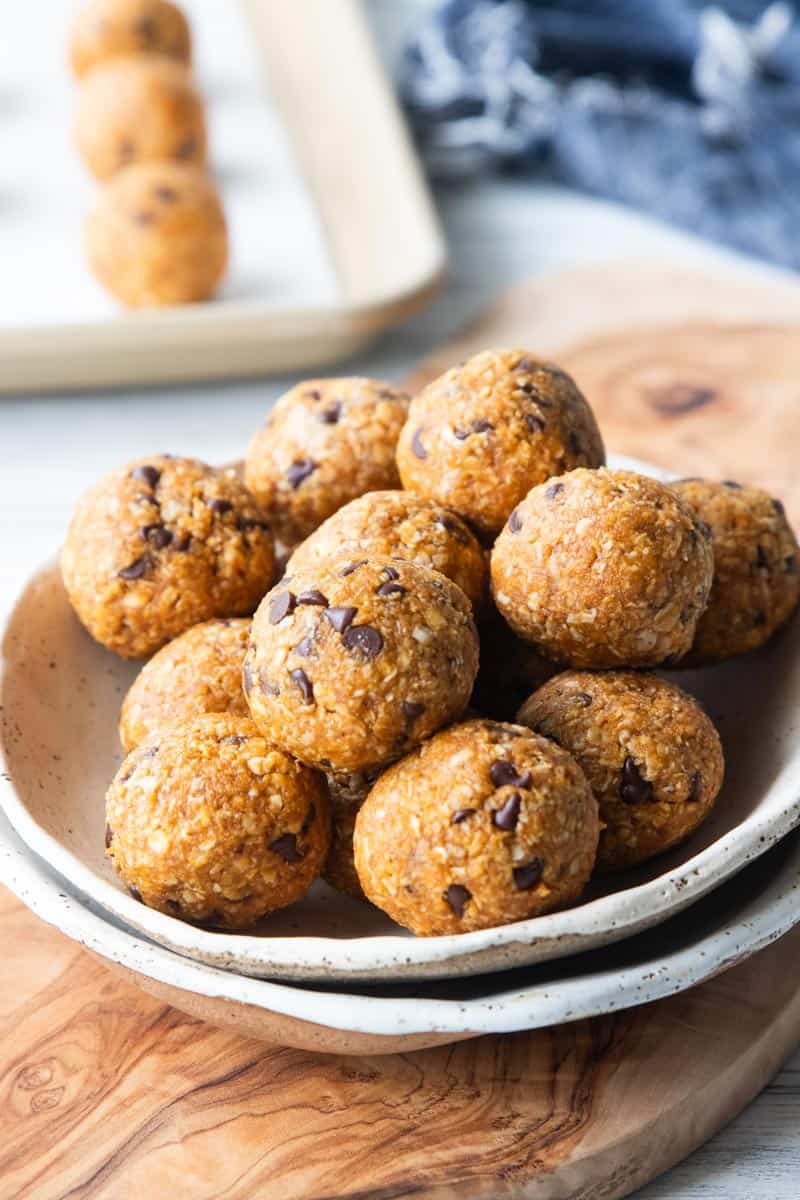 pumpkin protein balls stacked in a bowl