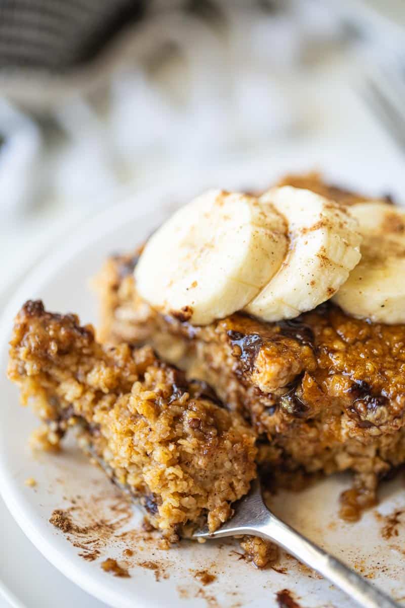 a fork taking a bite of a pumpkin baked oatmeal slice