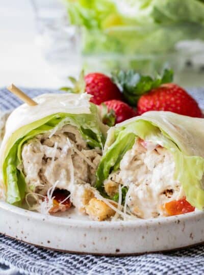 sliced chicken Ceasar wrap on plate