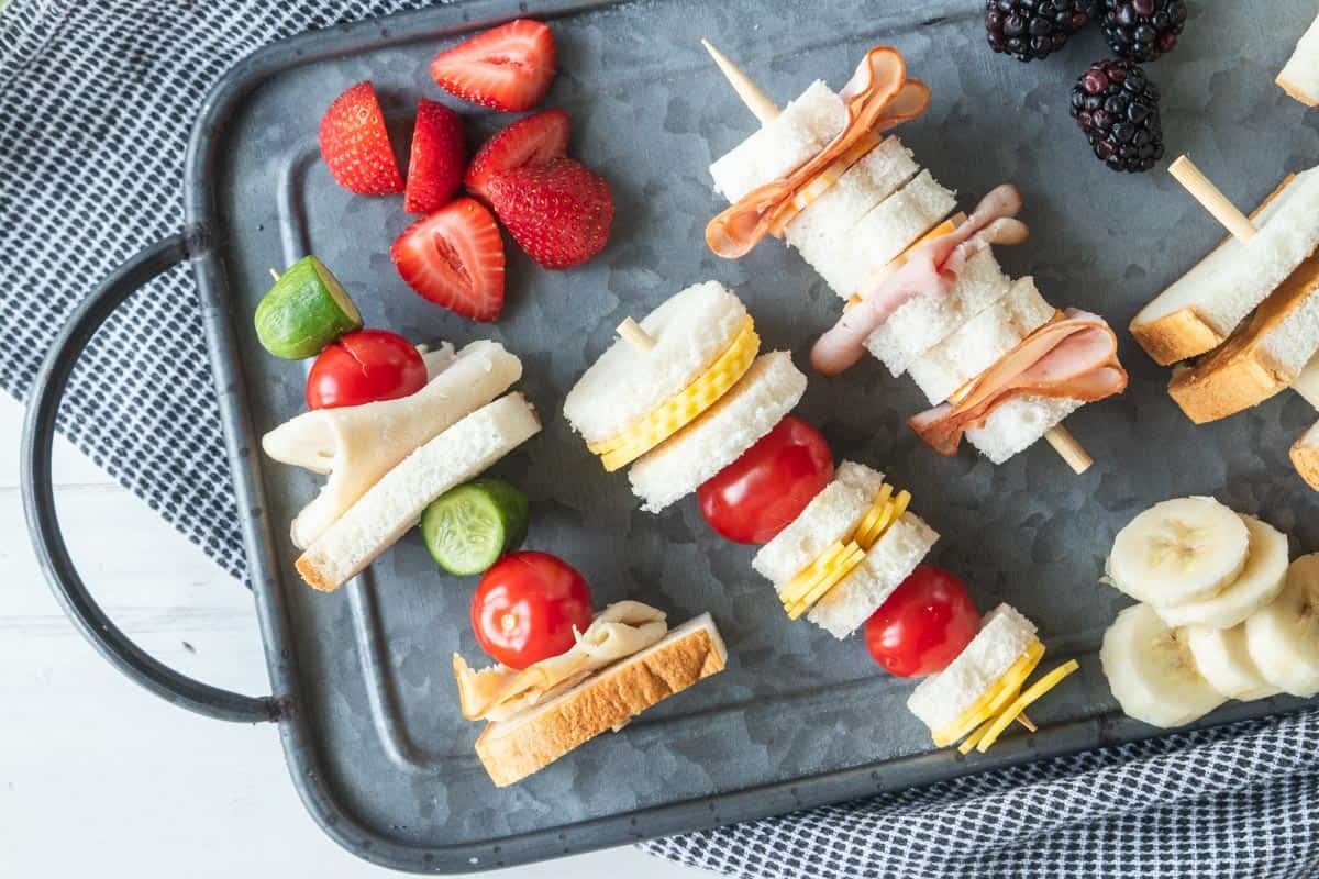 mini sandwiches on skewers on serving platter