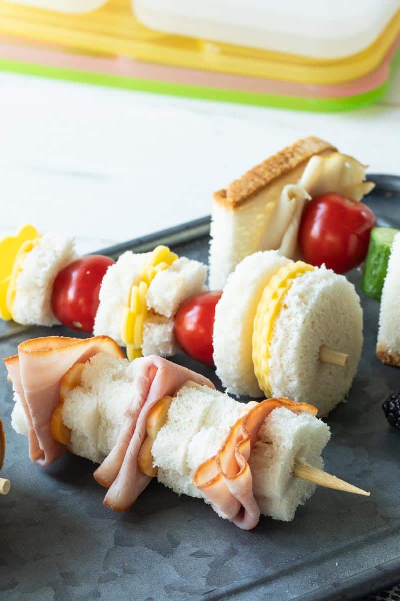 deli meat and cheese sandwiches on skewers