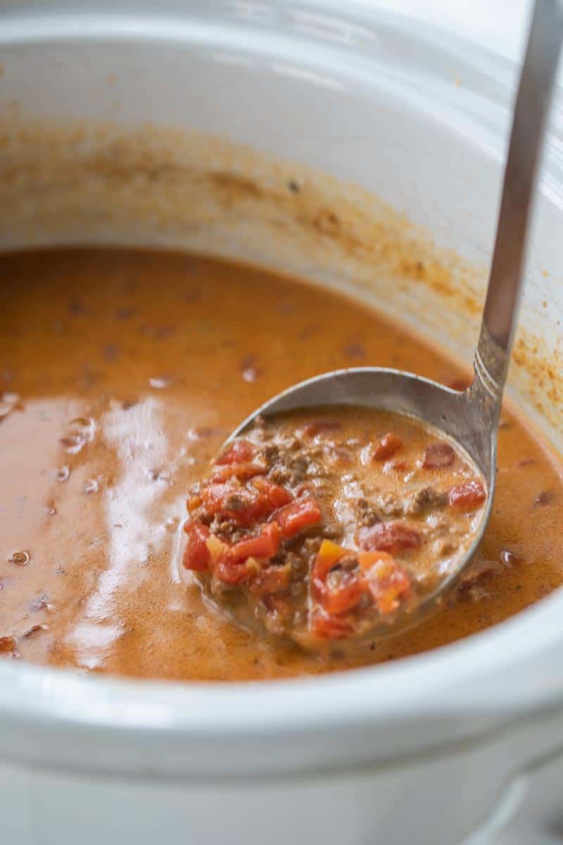 ladle scooping soup from crockpot