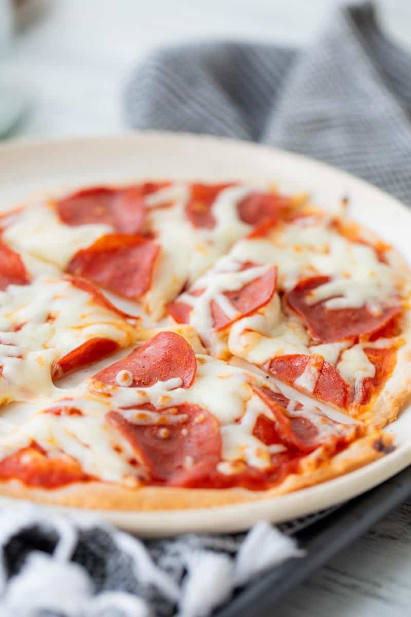 four slices of tortilla pizza on a plate